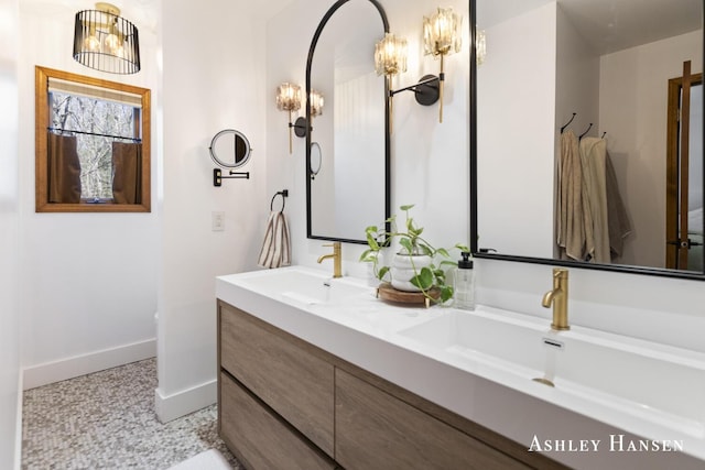 5615 Egypt Valley Ave NE, Belmont, MI 49306 - full bathroom with baseboards and double vanity