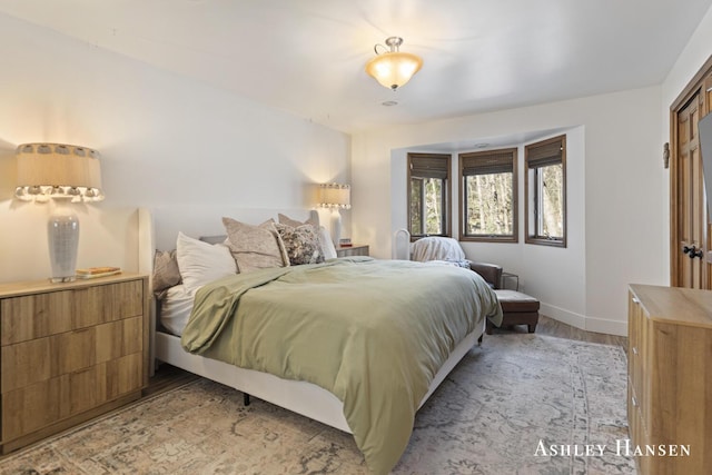 5615 Egypt Valley Ave NE, Belmont, MI 49306 - bedroom with light wood-style flooring and baseboards