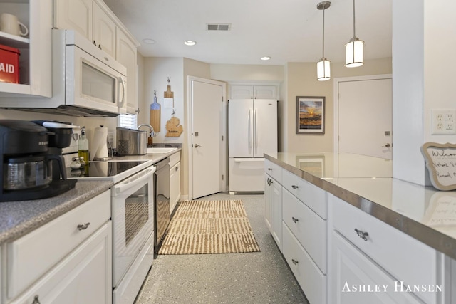 5615 Egypt Valley Ave NE, Belmont, MI 49306 - kitchen featuring white appliances, a sink, pendant lighting, white cabinets, and recessed lighting