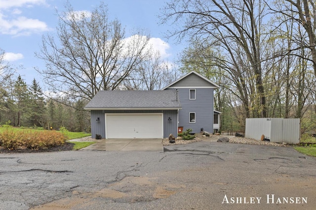 5615 Egypt Valley Ave NE, Belmont, MI 49306 - view of front of property with driveway and a garage