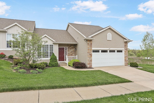 1549 Center Hill Rd SE Unit 37, Lowell, MI 49331 - view of front of house with stone siding, a shingled roof, driveway, and a front yard