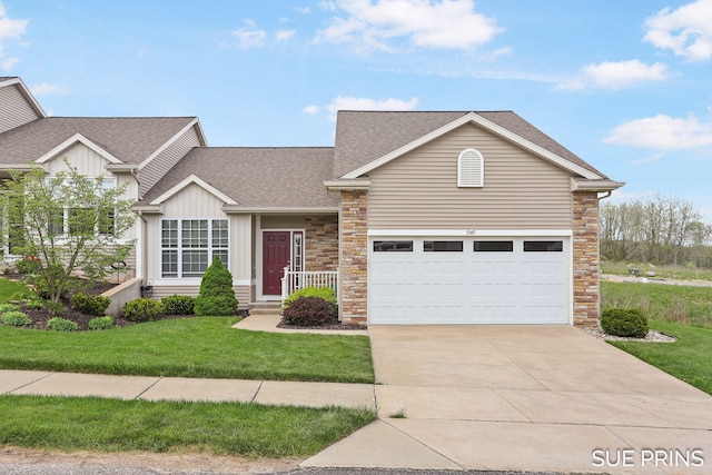 1549 Center Hill Rd SE Unit 37, Lowell, MI 49331 - view of front of house with roof with shingles, driveway, a front yard, stone siding, and board and batten siding