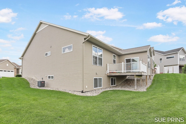 1549 Center Hill Rd SE Unit 37, Lowell, MI 49331 - back of property with central AC unit, a wooden deck, and a yard