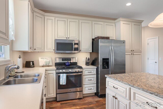 1549 Center Hill Rd SE Unit 37, Lowell, MI 49331 - kitchen featuring appliances with stainless steel finishes, a sink, light countertops, dark wood-style floors, and recessed lighting