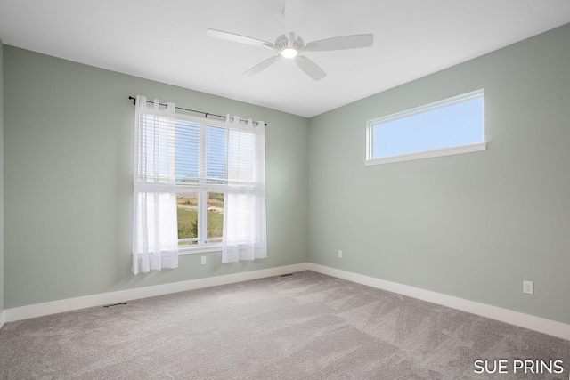 1549 Center Hill Rd SE Unit 37, Lowell, MI 49331 - spare room featuring carpet flooring, a ceiling fan, and baseboards