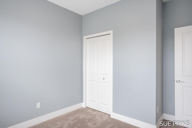 1549 Center Hill Rd SE Unit 37, Lowell, MI 49331 - unfurnished bedroom with light carpet and baseboards