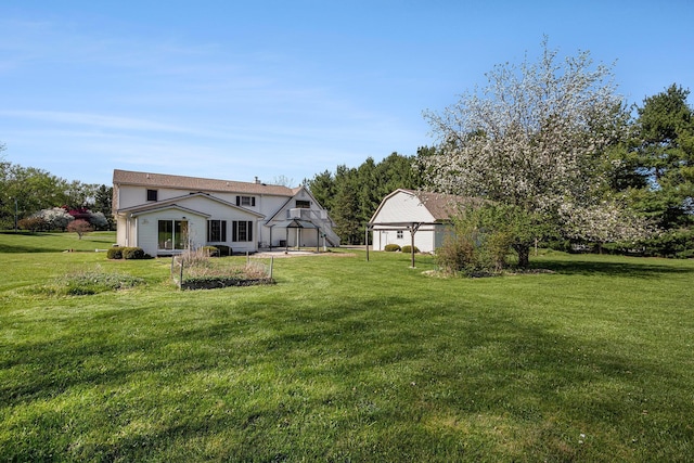 6010 Long Lake Rd, Berrien Springs, MI 49103 - back of property featuring a lawn