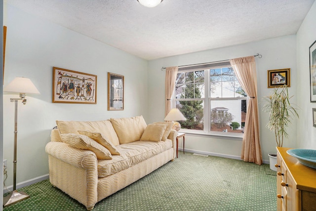 living room featuring carpet flooring, baseboards, and a textured ceiling