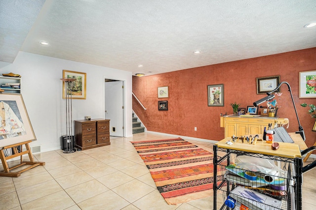 office area featuring recessed lighting, a textured ceiling, baseboards, and light tile patterned floors