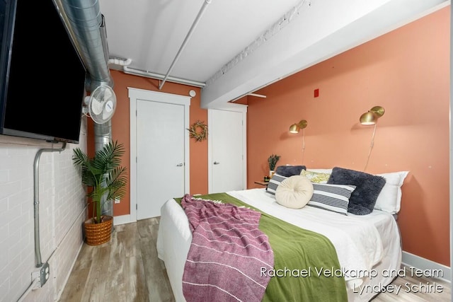 bedroom featuring wood finished floors
