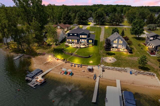 7140 Holiday Dr, Canadian Lakes, MI 49346 - drone / aerial view with a water view