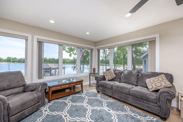 7140 Holiday Dr, Canadian Lakes, MI 49346 - living area featuring a water view, ceiling fan, recessed lighting, and baseboards