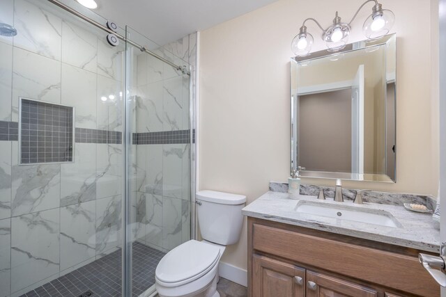 7140 Holiday Dr, Canadian Lakes, MI 49346 - full bath with a marble finish shower, toilet, and vanity