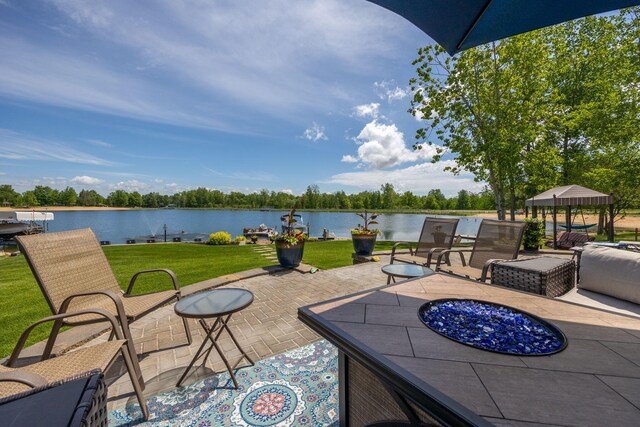 7140 Holiday Dr, Canadian Lakes, MI 49346 - view of patio / terrace featuring a water view