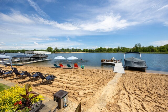 7140 Holiday Dr, Canadian Lakes, MI 49346 - view of dock with boat lift and a water view