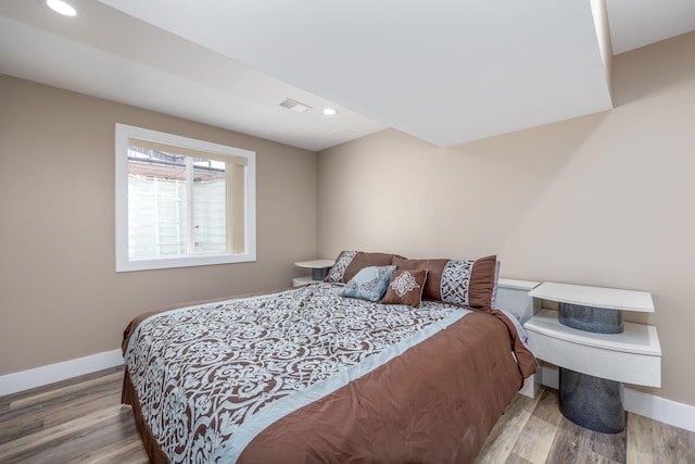 7140 Holiday Dr, Canadian Lakes, MI 49346 - bedroom featuring recessed lighting, visible vents, baseboards, and wood finished floors