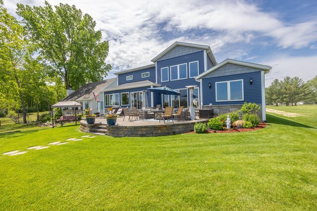 7140 Holiday Dr, Canadian Lakes, MI 49346 - back of house featuring a patio area, cooling unit, and a yard
