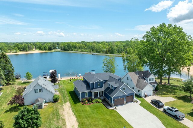 7140 Holiday Dr, Canadian Lakes, MI 49346 - drone / aerial view with a water view