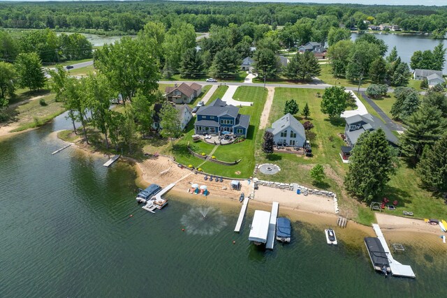 7140 Holiday Dr, Canadian Lakes, MI 49346 - drone / aerial view featuring a water view and a wooded view