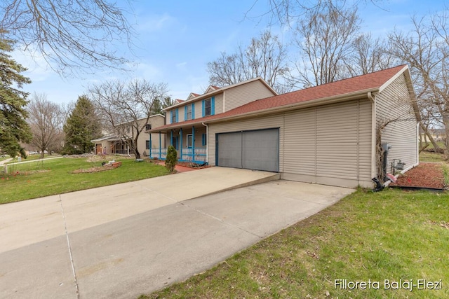 view of front of home featuring concrete driveway, a front yard, an attached garage, and covered porch