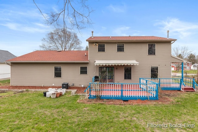 back of property with a yard and cooling unit