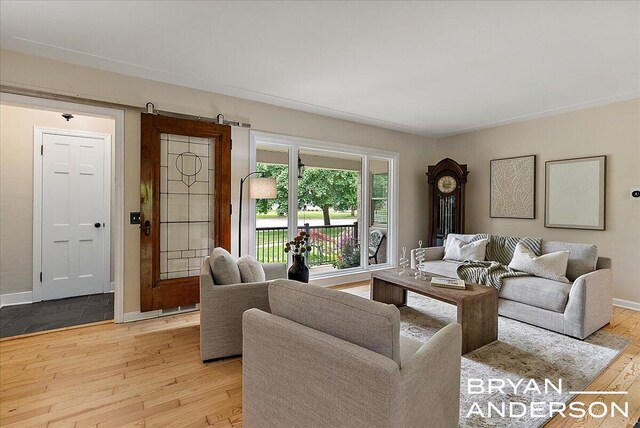 2120 Englewood Dr SE, East Grand Rapids, MI 49506 - living area featuring light wood-style flooring and baseboards
