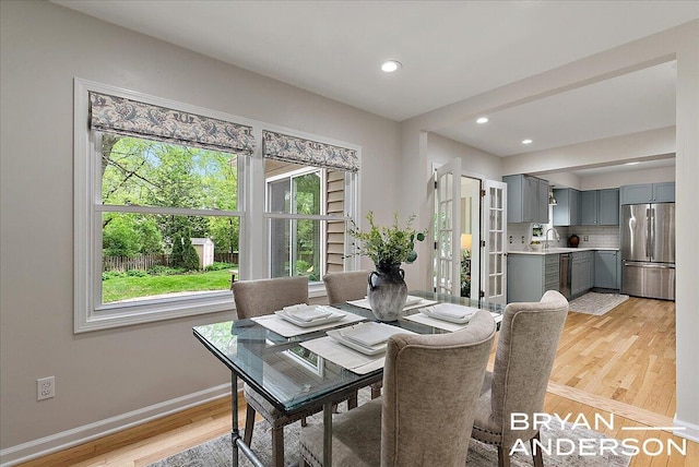 2120 Englewood Dr SE, East Grand Rapids, MI 49506 - dining room featuring light wood finished floors, baseboards, and recessed lighting