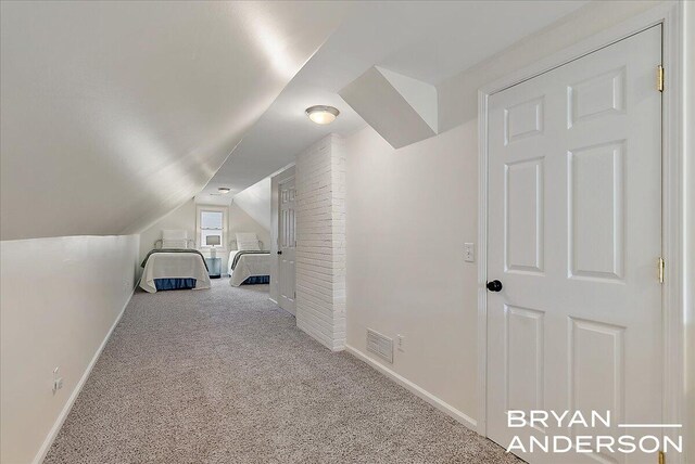 2120 Englewood Dr SE, East Grand Rapids, MI 49506 - unfurnished bedroom with vaulted ceiling, carpet flooring, and baseboards