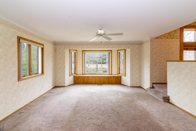9675 Nabozny Dr, Milan, MI 48160 - empty room featuring baseboards, ceiling fan, carpet, crown molding, and wallpapered walls