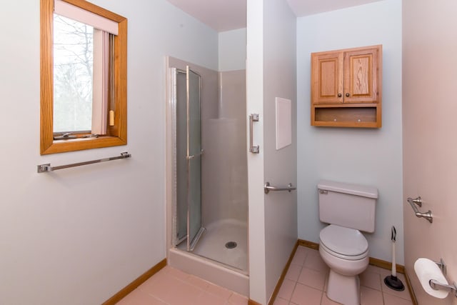9675 Nabozny Dr, Milan, MI 48160 - bathroom with toilet, a stall shower, baseboards, and tile patterned floors