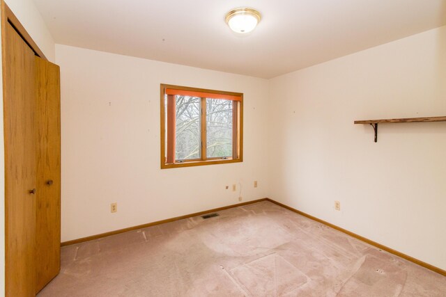 9675 Nabozny Dr, Milan, MI 48160 - unfurnished room featuring light carpet, baseboards, and visible vents