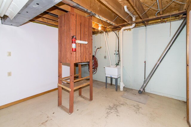 9675 Nabozny Dr, Milan, MI 48160 - unfinished basement featuring a sink