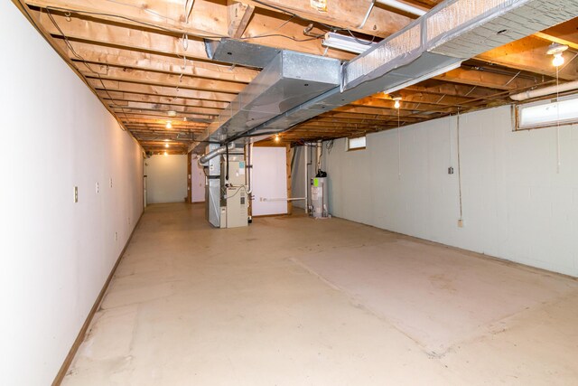 9675 Nabozny Dr, Milan, MI 48160 - unfinished below grade area with water heater and heating unit