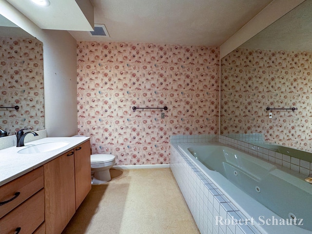 full bathroom featuring a tub with jets, beam ceiling, vanity, toilet, and wallpapered walls