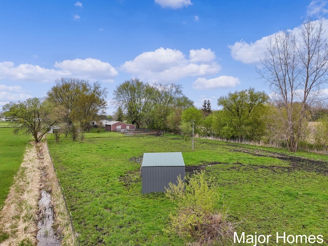 1864 92nd St SW, Byron Center, MI 49315 - view of green lawn featuring an outdoor structure, a view of rural / pastoral area, and an outbuilding