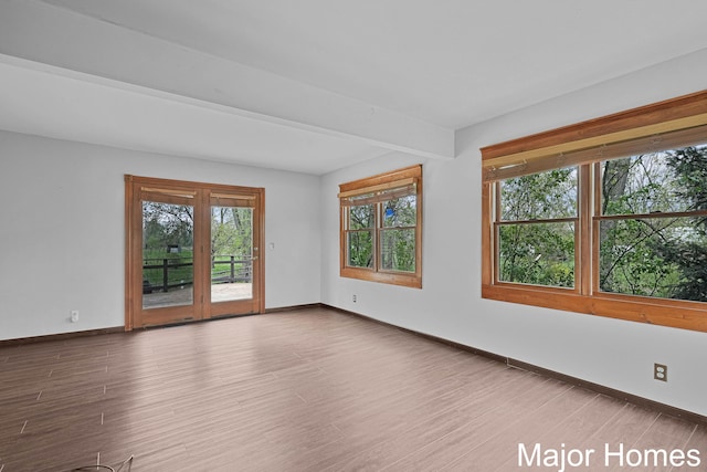 1864 92nd St SW, Byron Center, MI 49315 - unfurnished room with baseboards and wood finished floors
