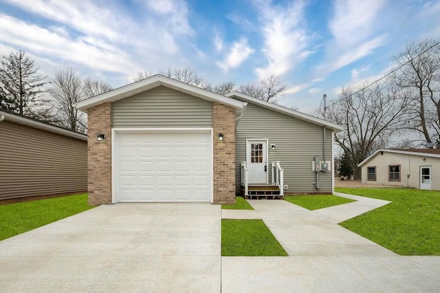 308 Hillview St, Buchanan, MI 49107 - view of front of property featuring concrete driveway, a front yard, brick siding, and an attached garage