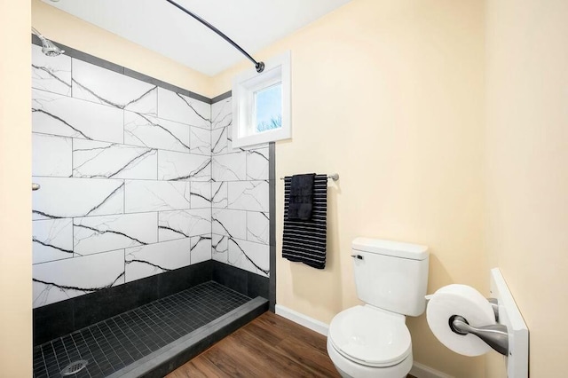 308 Hillview St, Buchanan, MI 49107 - bathroom with toilet, a stall shower, wood finished floors, and baseboards