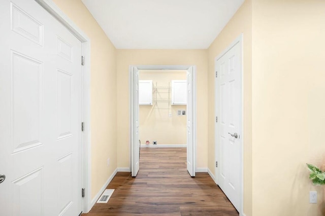 308 Hillview St, Buchanan, MI 49107 - hall with dark wood-type flooring, visible vents, and baseboards