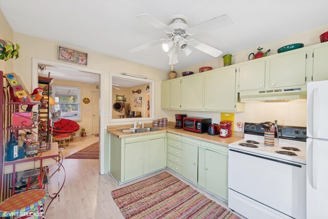 46353 Grand Beach Rd, Grand Beach, MI 49117 - kitchen with white appliances, a ceiling fan, under cabinet range hood, light countertops, and light wood finished floors