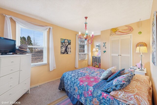 46353 Grand Beach Rd, Grand Beach, MI 49117 - carpeted bedroom featuring a closet, an inviting chandelier, baseboards, and visible vents