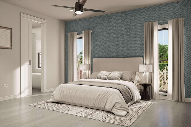 LOT9 Foster Ln, South Haven, MI 49090 - bedroom featuring an accent wall, baseboards, wallpapered walls, and wood finished floors