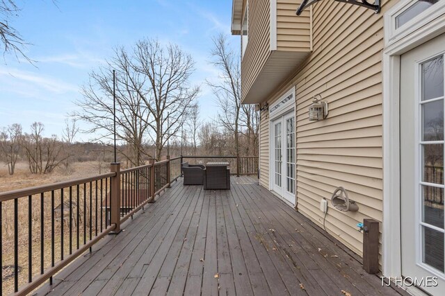 3969 Murray View Ave NE, Lowell, MI 49331 - wooden terrace with outdoor lounge area and french doors