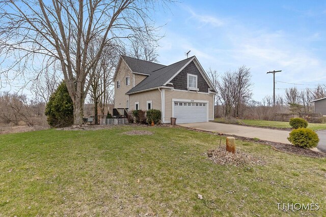 3969 Murray View Ave NE, Lowell, MI 49331 - view of home's exterior featuring a yard, an attached garage, and concrete driveway