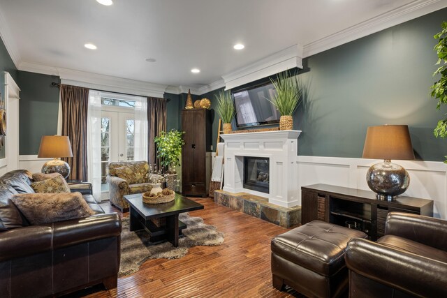 3969 Murray View Ave NE, Lowell, MI 49331 - living area featuring wainscoting, ornamental molding, french doors, and wood finished floors