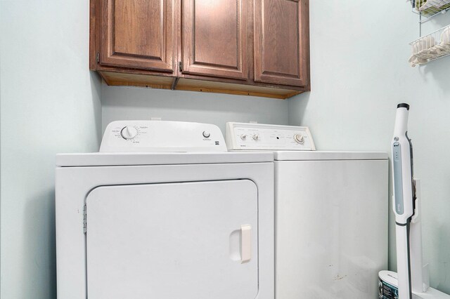 8170 Talaria Ter, Kalamazoo, MI 49009 - washroom featuring washing machine and clothes dryer and cabinet space