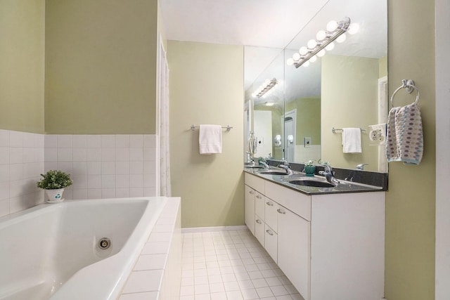 8170 Talaria Ter, Kalamazoo, MI 49009 - bathroom with double vanity, a tub with jets, tile patterned floors, and baseboards