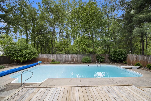 8170 Talaria Ter, Kalamazoo, MI 49009 - view of pool featuring a fenced backyard, a deck, and a diving board