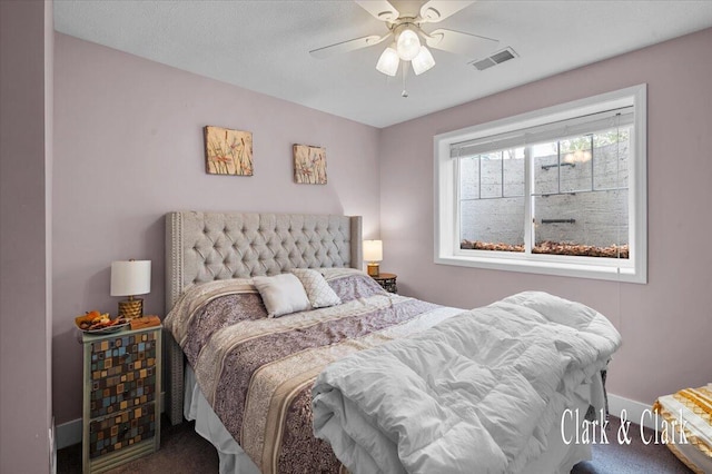 bedroom featuring carpet, visible vents, baseboards, and ceiling fan