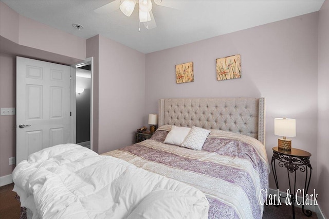 bedroom with carpet, a ceiling fan, and baseboards
